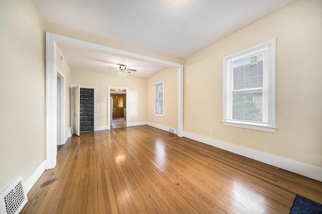 unfurnished room featuring hardwood / wood-style floors and ceiling fan