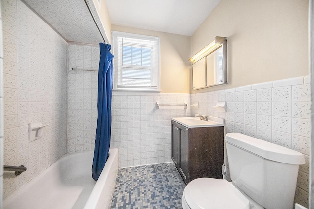 full bathroom featuring vanity, tile walls, shower / bathtub combination with curtain, and toilet