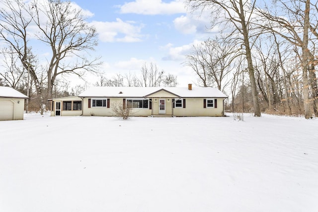 single story home with a sunroom