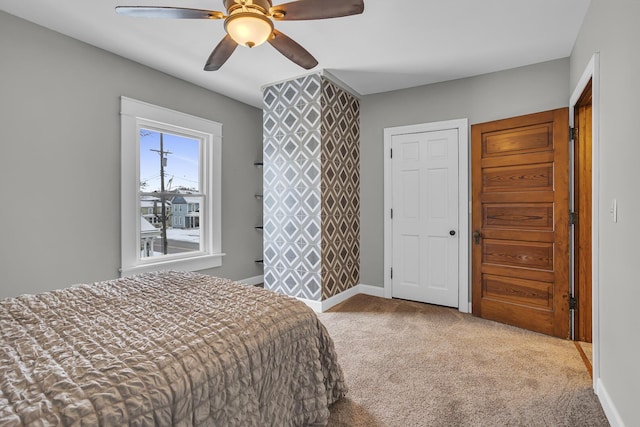 carpeted bedroom featuring ceiling fan