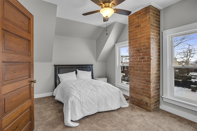 carpeted bedroom featuring ceiling fan and lofted ceiling