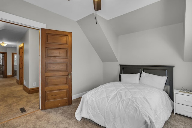 carpeted bedroom featuring lofted ceiling and ceiling fan