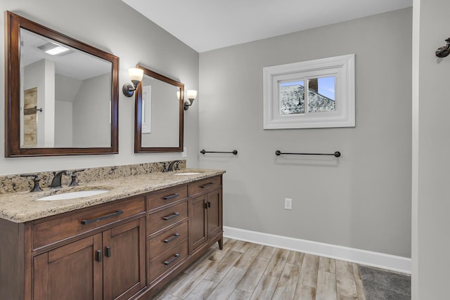 bathroom featuring vanity and hardwood / wood-style floors