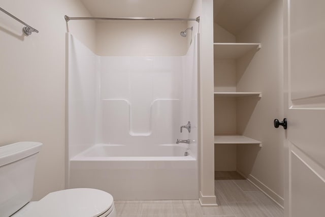 bathroom with shower / bathtub combination and toilet