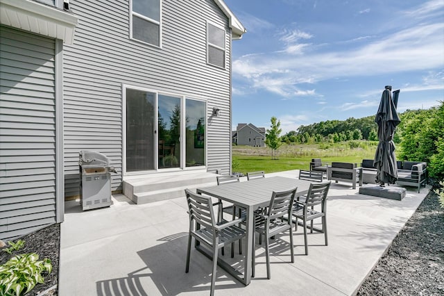 view of patio / terrace featuring an outdoor living space and a grill