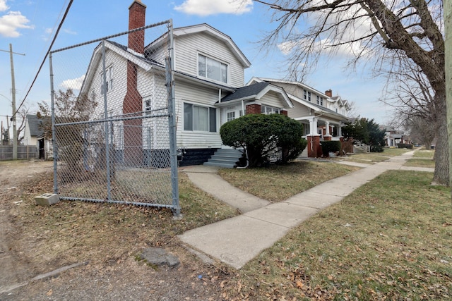 view of side of property with a yard