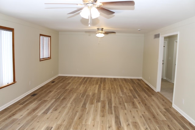 spare room featuring ceiling fan and light hardwood / wood-style flooring