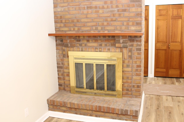 details with a fireplace and hardwood / wood-style floors