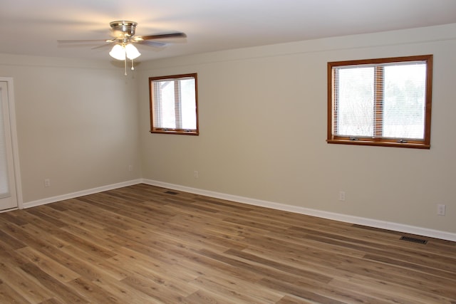 spare room featuring ceiling fan and hardwood / wood-style floors