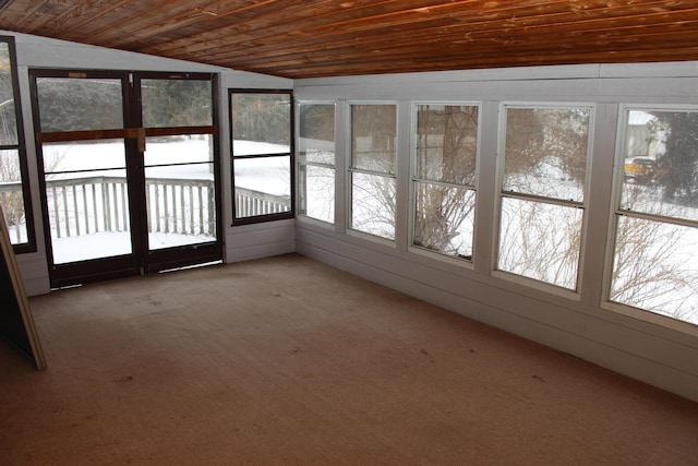 unfurnished sunroom featuring vaulted ceiling and wood ceiling