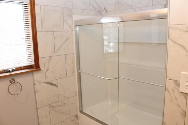 bathroom featuring enclosed tub / shower combo