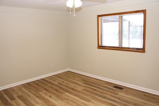 empty room featuring ceiling fan and wood-type flooring