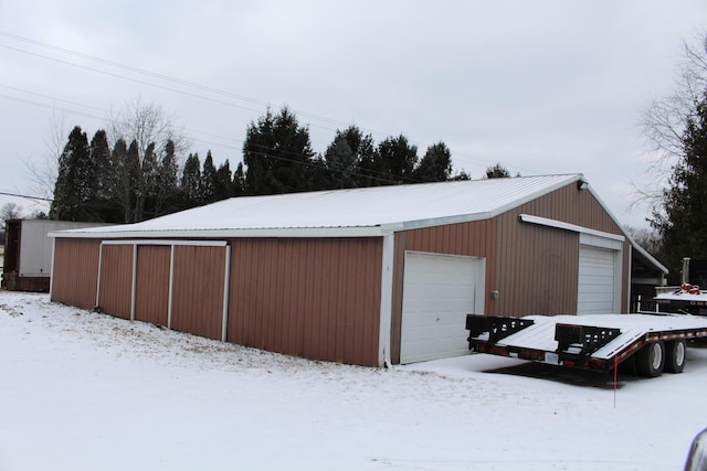 view of snow covered garage