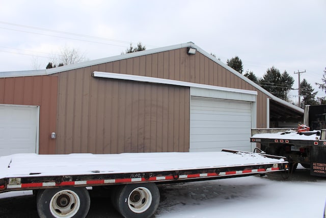 view of snow covered garage