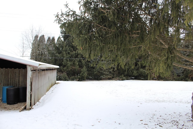 view of yard covered in snow