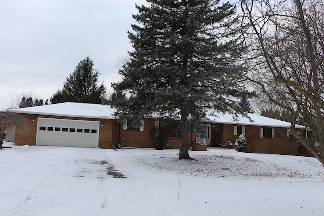 ranch-style home featuring a garage