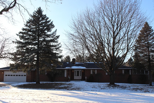 single story home featuring a garage