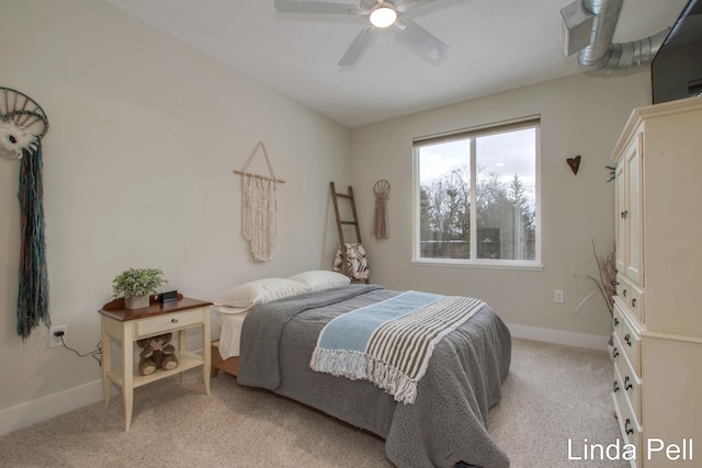 bedroom with ceiling fan, baseboards, and light carpet