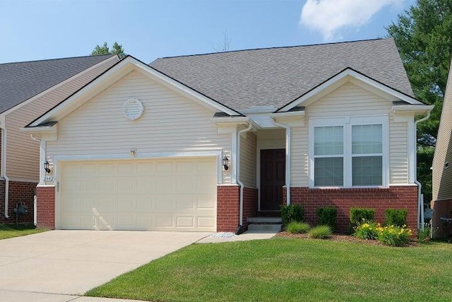 view of front of property featuring a garage and a front lawn