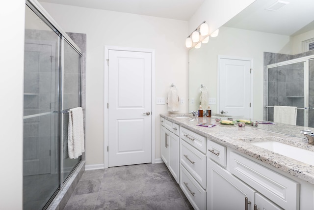 bathroom with vanity and an enclosed shower