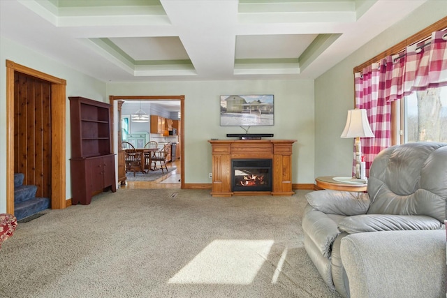 living room with coffered ceiling and carpet flooring