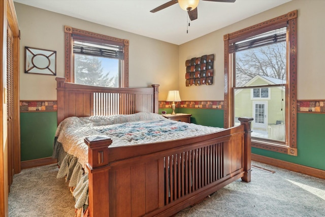 bedroom with light carpet and ceiling fan