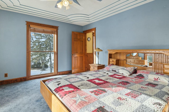 bedroom with multiple windows, carpet flooring, and ceiling fan