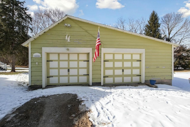 view of snow covered garage