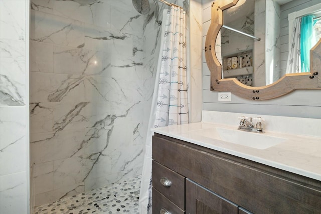 bathroom with vanity and walk in shower