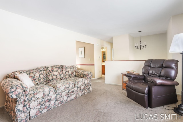 carpeted living room with a notable chandelier