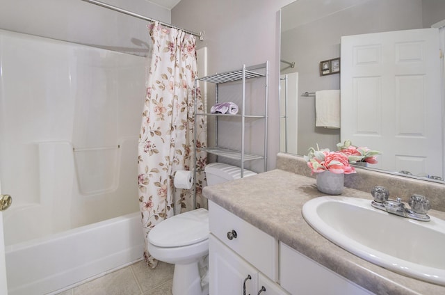 full bathroom with shower / tub combo, vanity, tile patterned floors, and toilet