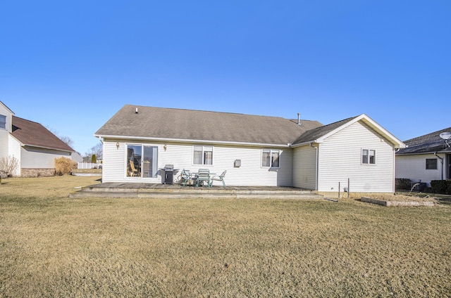 back of property featuring a yard and a patio area