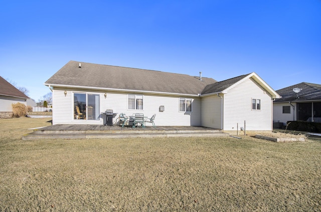 rear view of property with a yard and a patio area