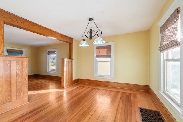 spare room with hardwood / wood-style floors