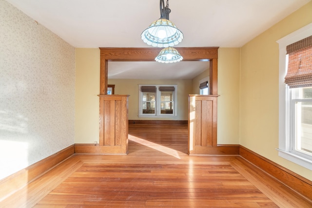 unfurnished dining area with hardwood / wood-style floors