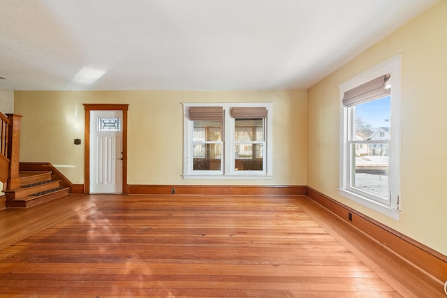 unfurnished living room featuring light wood-type flooring