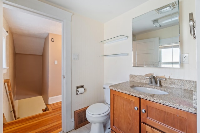 bathroom with vanity, tile patterned floors, and toilet