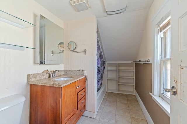 full bathroom featuring tile patterned floors, toilet, shower / tub combo, and vanity