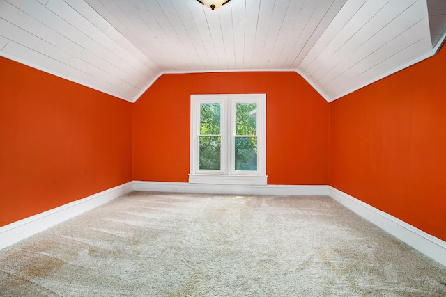 additional living space featuring vaulted ceiling, carpet floors, and wooden ceiling