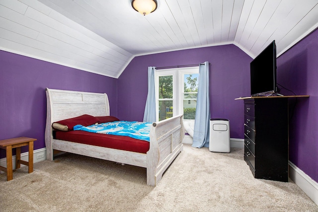 bedroom featuring lofted ceiling, light carpet, and wooden ceiling