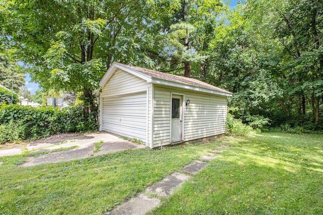 garage featuring a yard