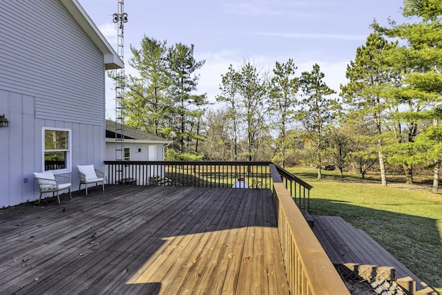 wooden terrace with a yard