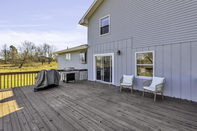 wooden terrace featuring area for grilling