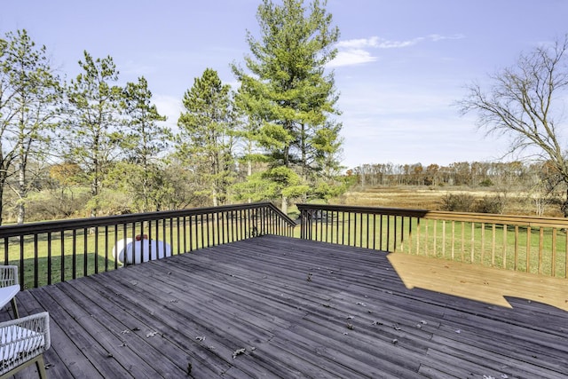 wooden deck featuring a yard