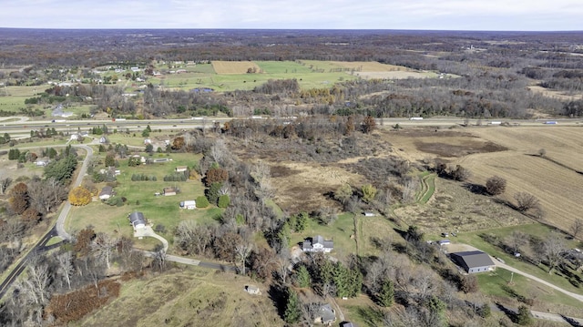 birds eye view of property featuring a rural view