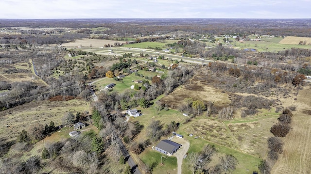 birds eye view of property featuring a rural view