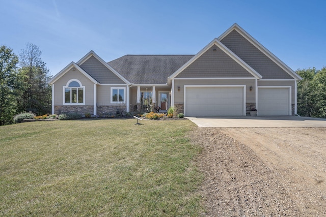 craftsman inspired home with a garage and a front yard