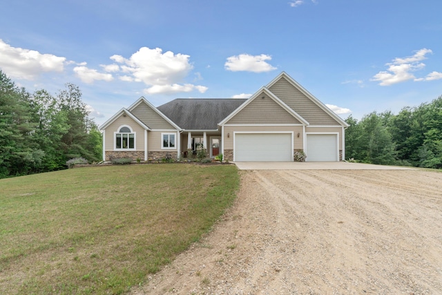 view of front facade featuring a garage and a front lawn