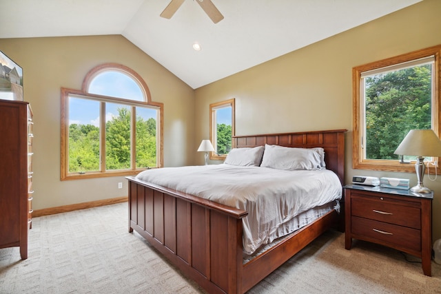 carpeted bedroom featuring vaulted ceiling and ceiling fan