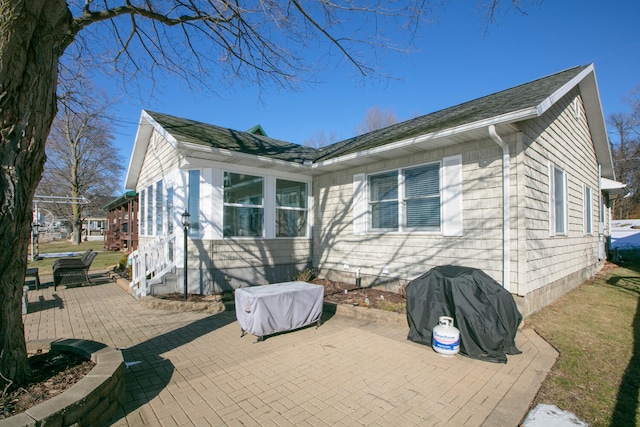 back of house with a patio